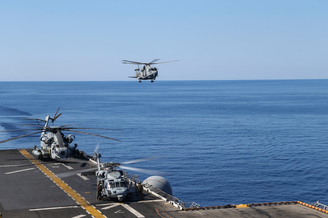 An Italian SH-101A medium-lift helicopter prepares to land aboard the amphibious assault ship USS Bataan during deck landing qualifications June 24.
