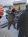 U.S. Army Spc. Dane Kastl, a search-and-extraction team member with the Colorado National Guard’s Chemical, Biological, Radiological, Nuclear and high-yield explosive Enhanced Response Force Package, performs an extraction by removing the door of an overturned vehicle during Exercise Arctic Eagle 2020, Fort Wainwright, Alaska, Feb. 26, 2020.