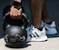 A competitor grabs the kettle bells before their turn during the Tunnell Hall Farmer’s Walk Kettle Bell Challenge at Joint Base Langley-Eustis, Virginia, June 19, 2020. The challenge helped Airmen build comradery by engaging in friendly competition while adhering to safety measures in place. (U.S. Air Force photo by Senior Airman Marcus M. Bullock)