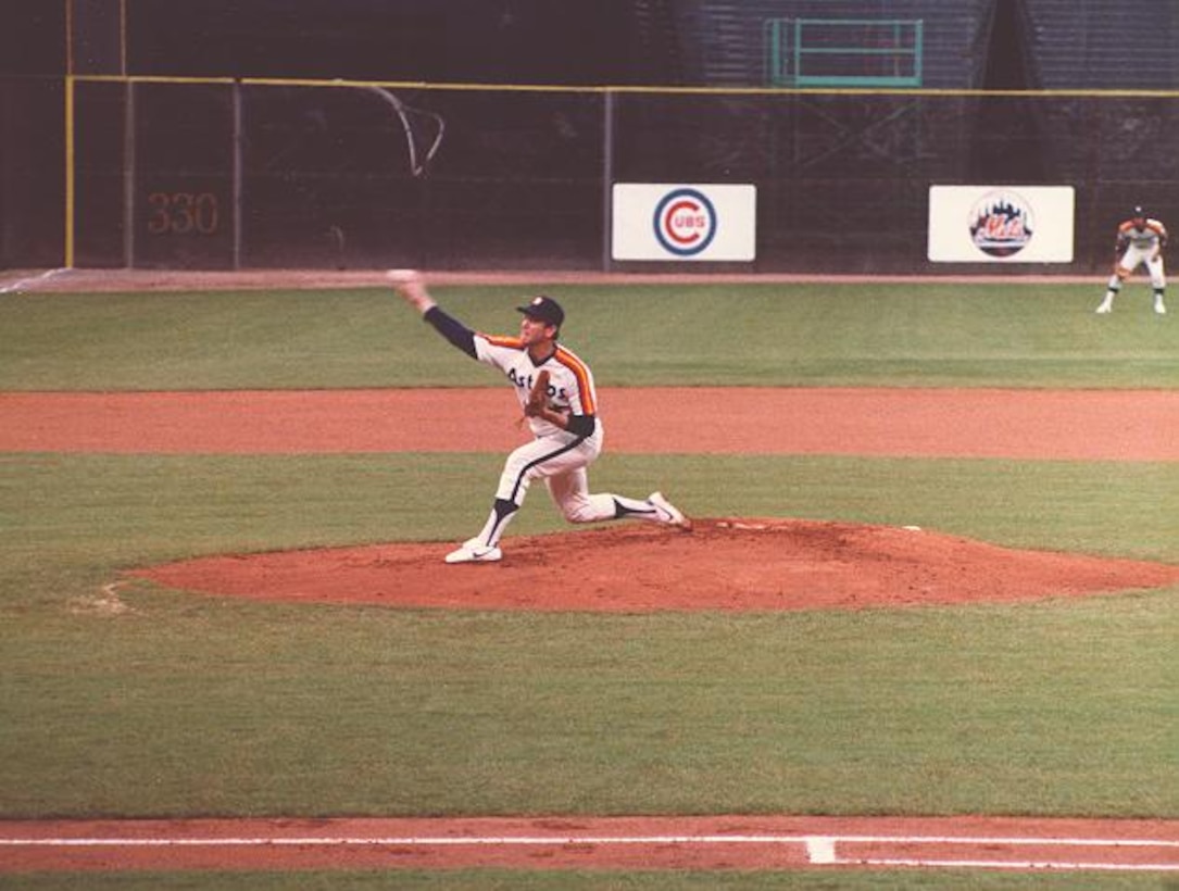 A pitcher throws a ball.