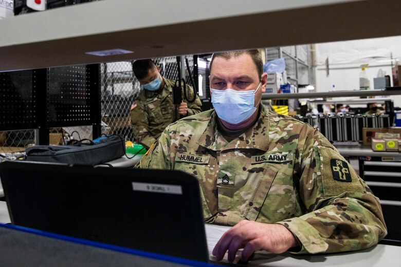 Army Sgt. 1st Class George Hummel, a biomedical equipment specialist with the 807th Medical Command, inputs data while maintaining medical equipment at the Medical Equipment Concentration Site for the 88th Readiness Division in Ogden, Utah, April 17. Huntsville Center’s Resource Efficiency Manager Program provides the 88th RD with site energy plans encompassing projects that achieve sustainable energy management at the 88th RD’s more than 250 sites located across 19 states.
