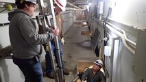 From left to right: Matthew Flanagan, Kreg Buryta and Jay Haugen testing the orifice debris plunger.