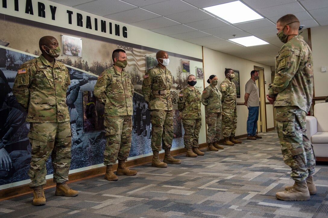 Sergeant Major of the Army talks to a group of Soldiers lined up.