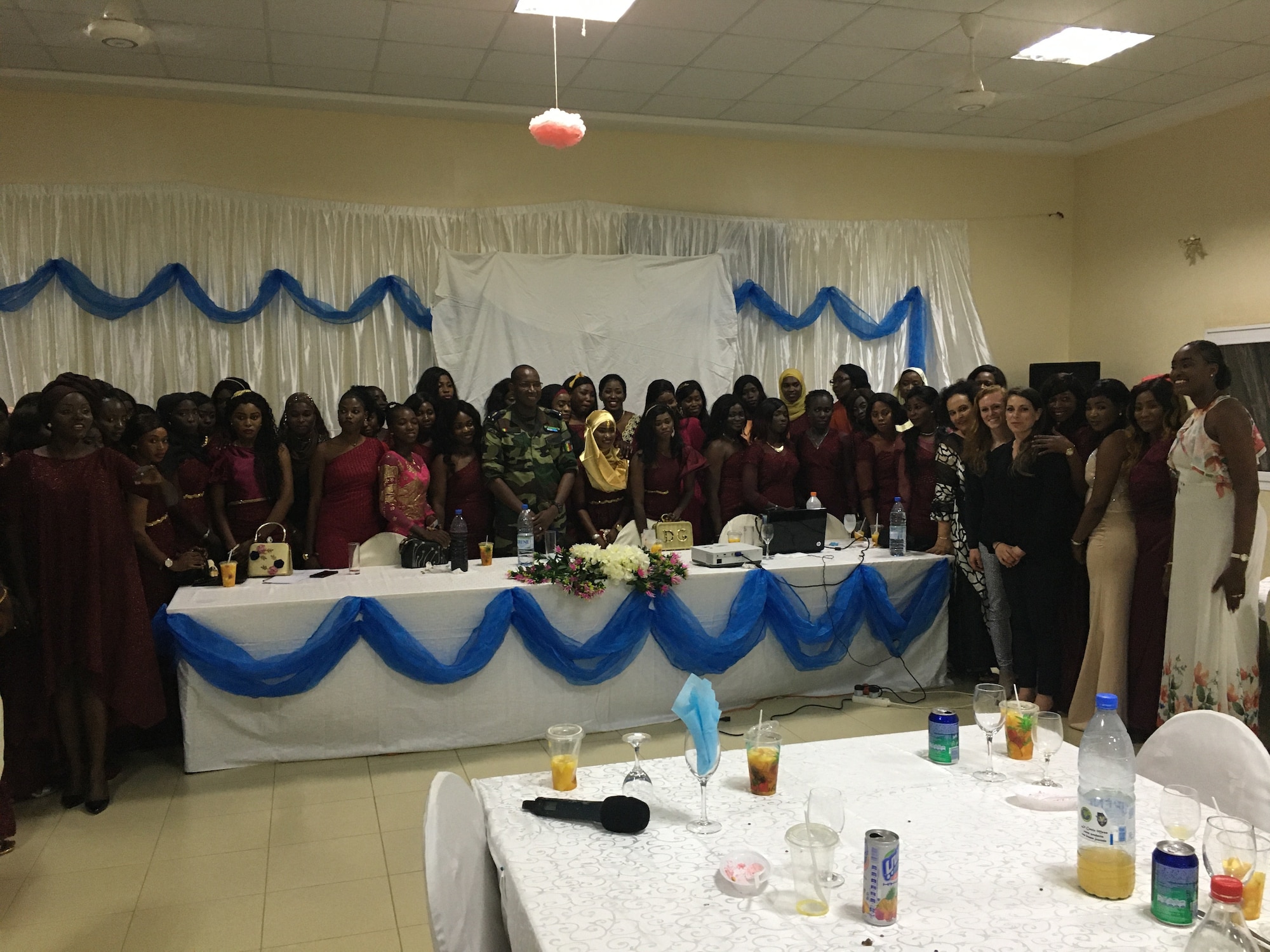 Members of the 818th Mobility Support Advisory Squadron and Senegalese Air Force pose for a photo at the Women's Military Integration Dinner Debate in Senegal, Africa, March 7, 2020.  The event was held in honor of International Women's Day and included discussions on opportunities and challenges associated with advancing the participation of and opportunities for women in the Senegalese Air Force.