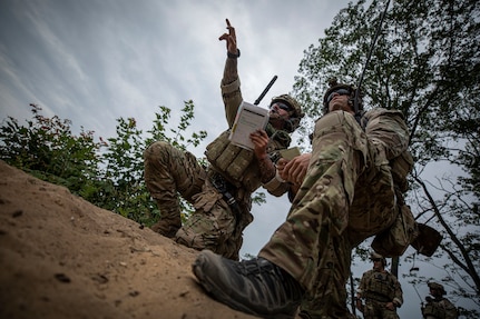 U.S. Air Force Tactical Air Control Party Airmen point out targets during tactical training at the Camp Grayling Joint Maneuver Training Center in Michigan during Northern Strike 19, July 24, 2019. The National Guard Bureau-sponsored exercise will continue in 2020, uniting service members from more than 20 states, multiple service branches and numerous coalition countries at the Camp Grayling Joint Maneuver Training Center and the Alpena Combat Readiness Training Center in northern Michigan.