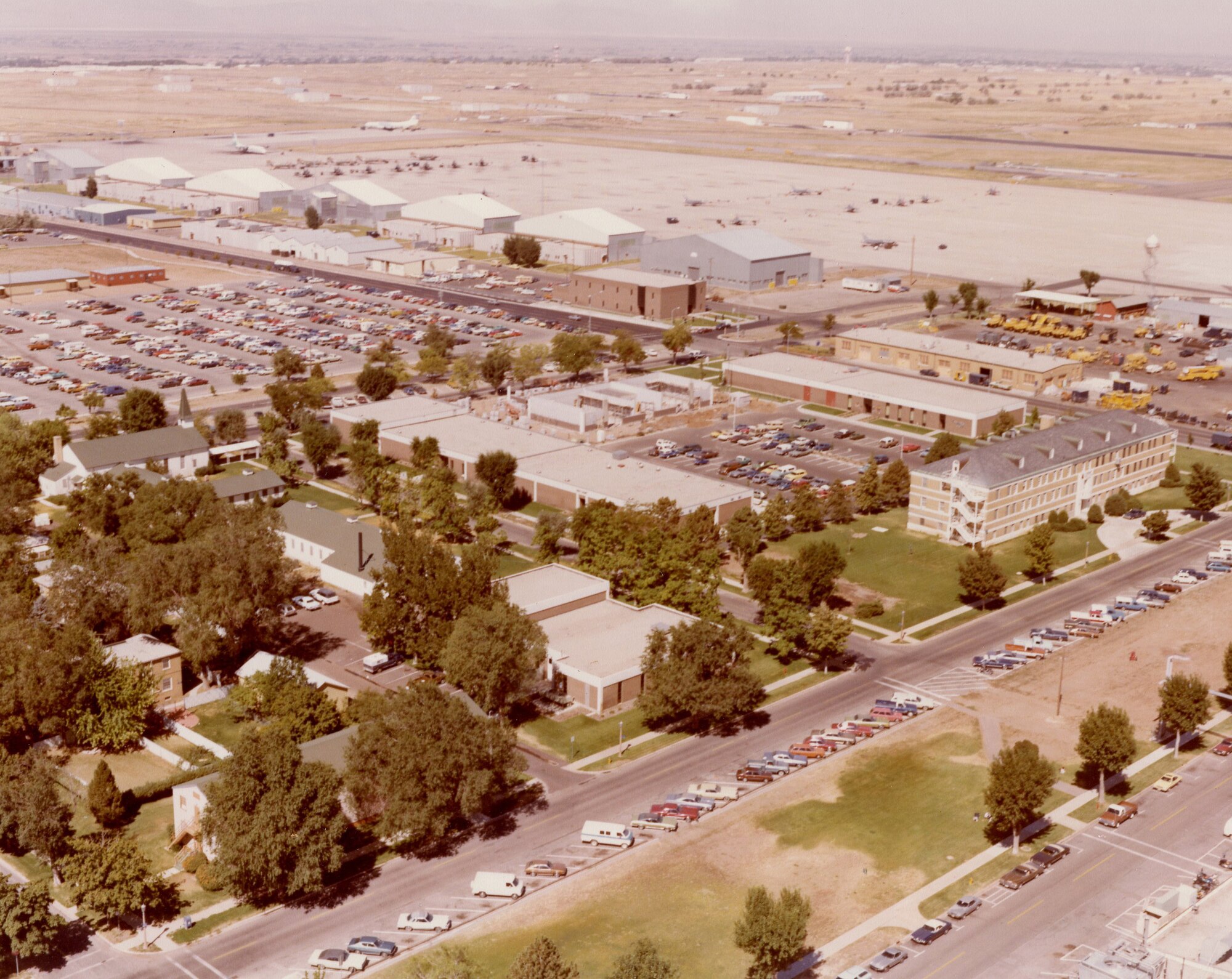 Aerial view of Hill AFB (D Ave. in foreground), from the southeast looking northwest, c. 1979.