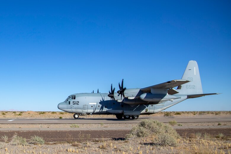 A U.S. Marine Corps KC-130J Hercules aircraft with Marine Aerial Refueler Transport Squadron (VMGR) 352 conducts a touch and go exercise at Auxiliary Airfield II aboard Marine Corps Air Station (MCAS) Yuma training ground on June 9, 2020. VMGR-352 is stationed out of Marine Corps Air Station Miramar. (U.S. Marine Corps photo by LCpl Gabrielle Sanders)