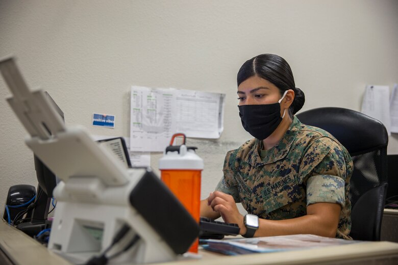 U.S. Marine Corps LCpl. Vanessa HernandezLopez, an administrative specialist with Installation Personnel Admin Center (IPAC), Marine Corps Air Station (MCAS) Yuma, inputs information on the computer during her daily routine on MCAS Yuma, June 10, 2020. IPAC handles all administrative services to all Marines and their family members assigned to MCAS Yuma. (U.S. Marine Corps photo by Lance Cpl John Hall)