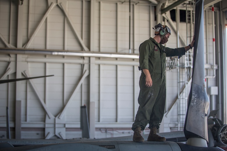 U.S. Marines Corps Cpl Kyle Sewer, a MV-22 tiltrotor mechanic with Marine Operational Test and Evaluation Squadron (VMX) 1, conducts routine maintenance on a MV-22 Osprey on Marine Corps Air Station (MCAS) Yuma, June 18, 2020. VMX-1 is an operational test squadron that tests multiple aircraft, allowing the continuation of improving the safety, reliability, and lethality of Marine Corps aircraft. (U.S. Marine Corps photo by Lance Cpl John Hall)