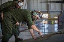 U.S. Marines Corps Cpl Kyle Sewer and Cpl Reid Ellis Jr, MV-22 tiltrotor mechanics with Marine Operational Test and Evaluation Squadron (VMX) 1, conduct routine maintenance on a MV-22 Osprey on Marine Corps Air Station (MCAS) Yuma, June 18, 2020. VMX-1 is an operational test squadron that tests multiple aircraft, allowing the continuation of improving the safety, reliability, and lethality of Marine Corps aircraft. (U.S. Marine Corps photo by Lance Cpl John Hall)