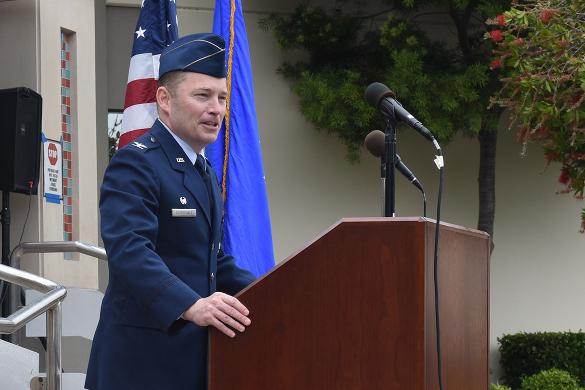 Colonel Raymond Clydesdale speaking at podium