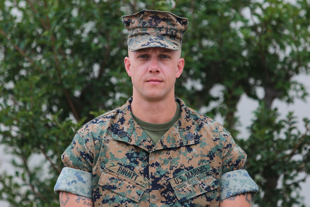 U. S. Marine Corps Staff Sgt. Matthew Pruitt, the staff noncommissioned officer in charge of the Miramar automated test equipment detachment of Center for Naval Aviation Technical Training Unit North Island, poses for a photo on Marine Corps Air Station Miramar, California, June 15, 2020. Pruitt was awarded a Navy and Marine Achievement Medal for his heroic rescue of a civilian from a dog attack. (U.S. Marine Corps photo by Lance Cpl. Krysten Houk)