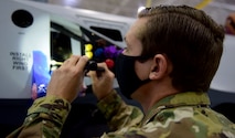 Staff Sgt. Anthony, 432nd Aircraft Maintenance Squadron crew chief, checks inside the panels of an MQ-9 Reaper.