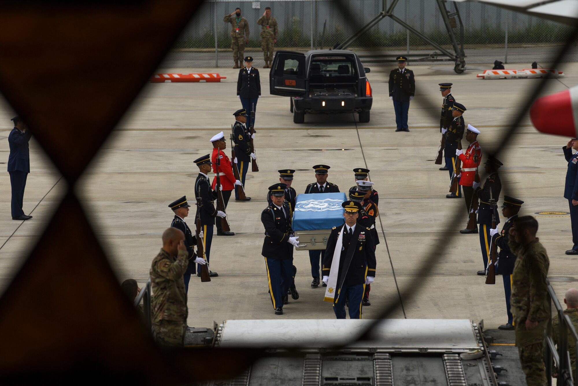 UNC Honor Guard carry transfer case to aircraft