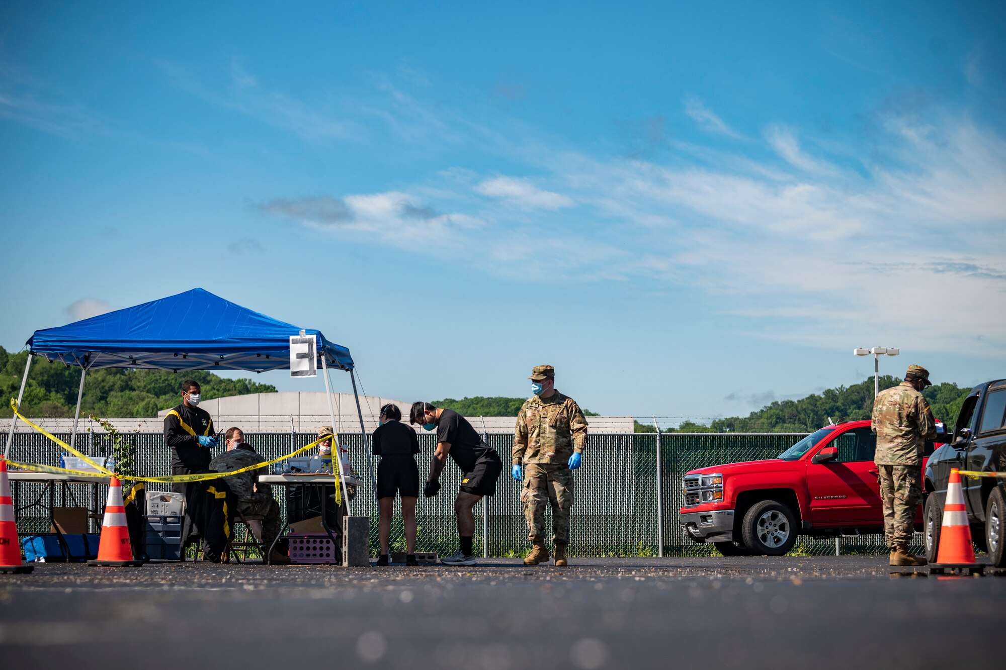 The WVNG's Chemical, Biological, Radiological, Nuclear and Explosive (CBRNE) Battalion, the 35th Civil Support Team (CST), and the 35th Enhanced Response Force Package (CERFP), which make up Task Force CRE, and Task Force Medical personnel collaborated with and assisted various West Virginia State agencies with COVID-19 testing May 22, 2020 in Charleston, W.Va.The high-density testing lanes are a part of Gov. Jim Justice's initiative to increase testing opportunities for minorities and other vulnerable populations in medically-underserved counties. (U.S. Air National Guard Photo by Staff Sgt. Caleb Vance)