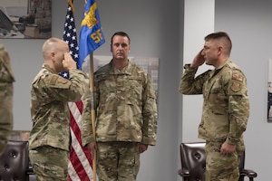 Lt. Col. Jason E. Stack salutes Col. Joseph A. Engelbrech III to assume command of the 316th Security Forces Squadron during a change of command ceremony at Joint Base Andrews, Md., June 24, 2020.