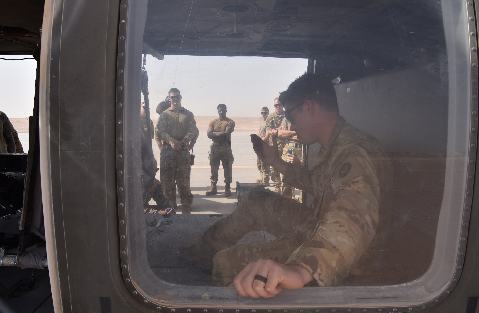 Members of the 378th Expeditionary Civil Engineering Squadron Fire Department receive familiarization training from members of Task Force Javelin at Prince Sultan Air Base, Kingdom of Saudi Arabia, June 25, 2020. The crucial training enables the 378th ECES to work seamlessly with members of TFJ to load critically injure or ill patients for Med-Evac, quickening the loading of patients while maintaining a safe environment for responders.