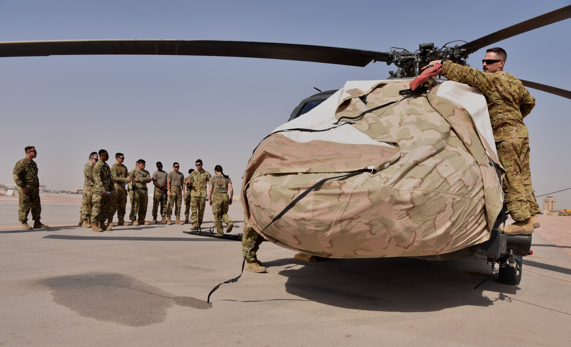 Members of the 378th Expeditionary Civil Engineering Squadron Fire Department receive familiarization training from members of Task Force Javelin at Prince Sultan Air Base, Kingdom of Saudi Arabia, June 25, 2020. The crucial training enables the 378th ECES to work seamlessly with members of TFJ to load critically injure or ill patients for Med-Evac, quickening the loading of patients while maintaining a safe environment for responders.