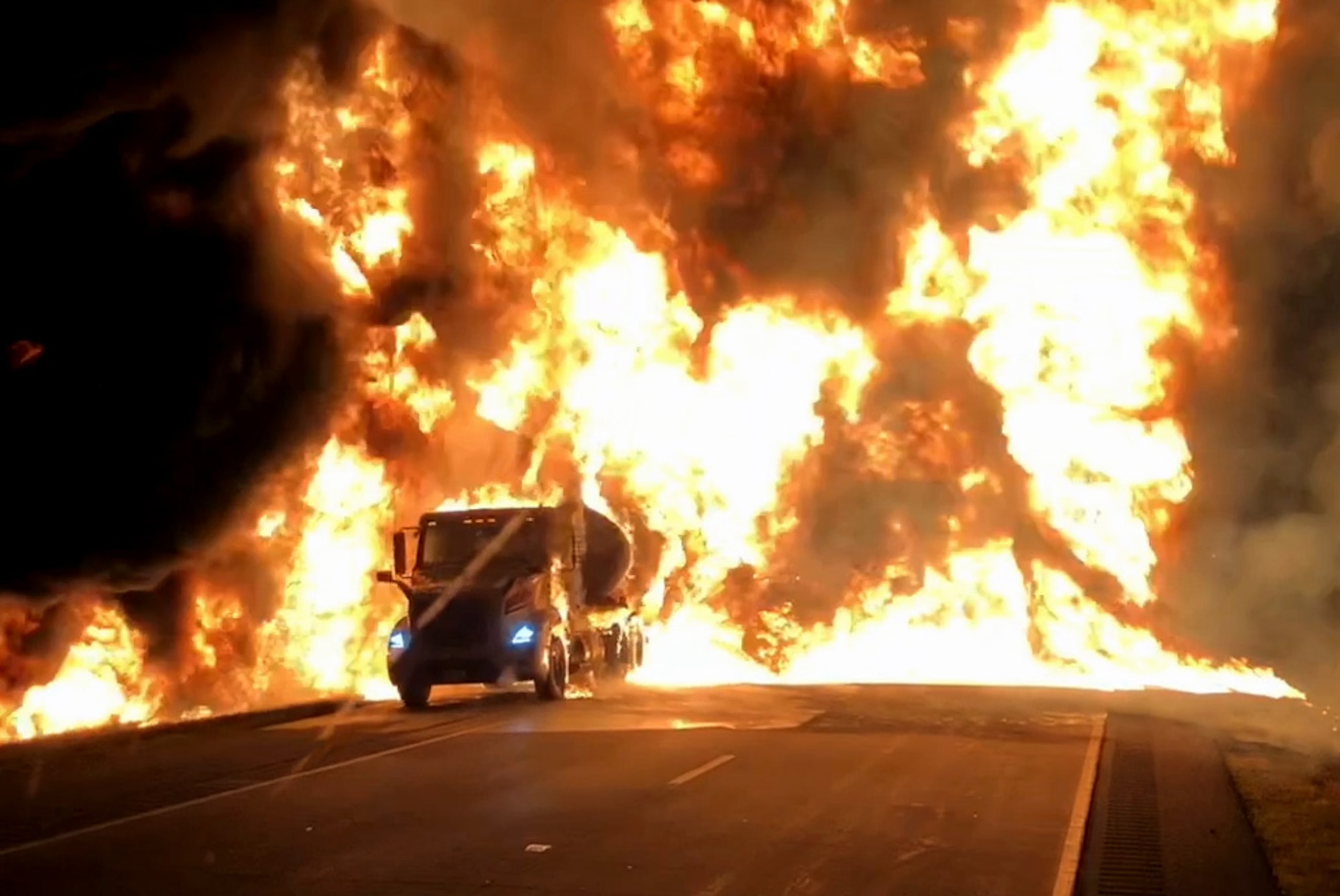 A semi trailer tanker  filled with gasoline is engulfed in flames on U.S. Highway 31 in Howard County, Indiana, June 19, 2020. Grissom Fire Department used a combination of aqueous film forming foam and water to extinguish the blaze.  (U.S. Air Force photo/Jason Cahill)