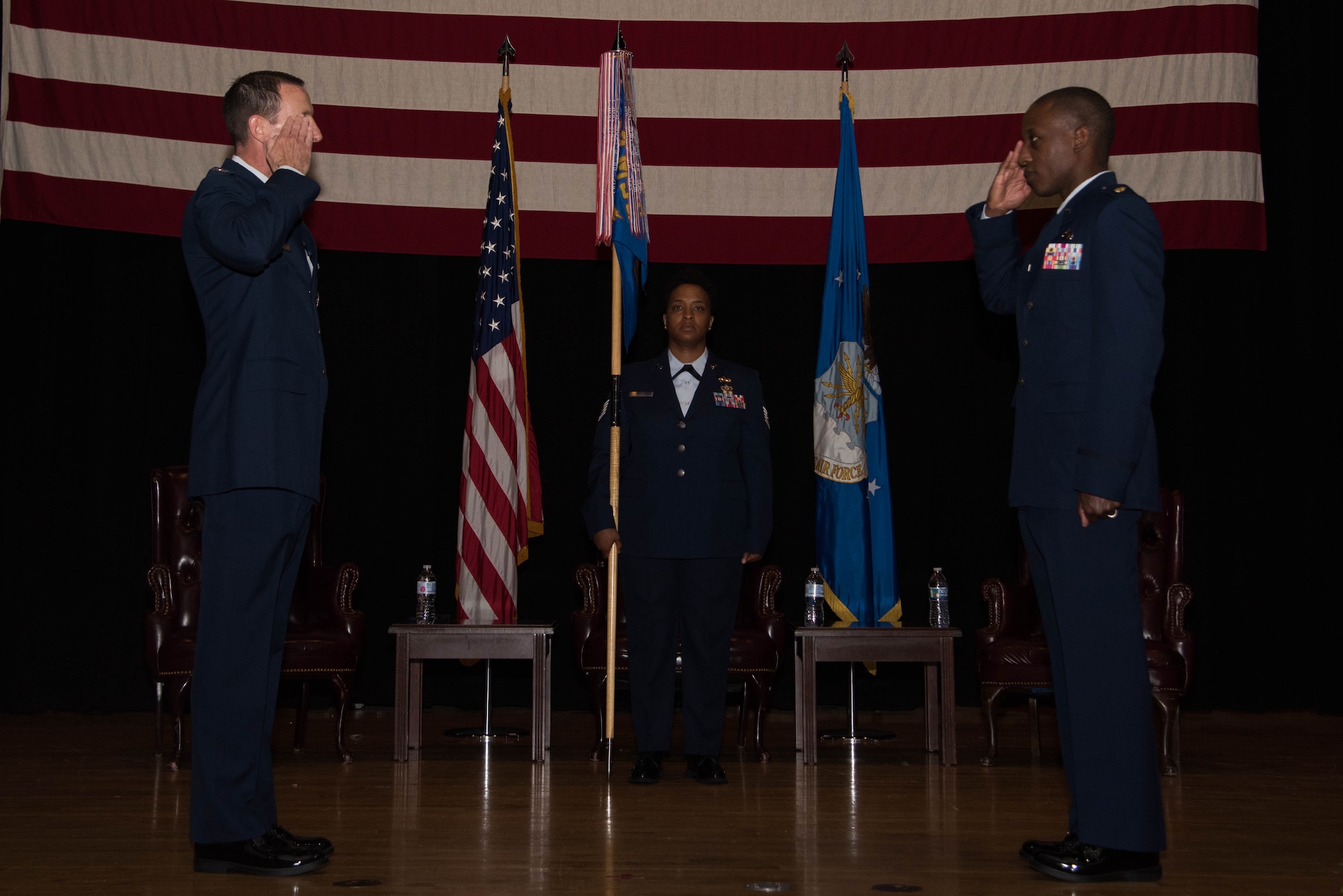 Maj. Kenneth Hawkins, 22nd Contracting Squadron incoming commander, right, assumes command during a change of command ceremony June 18, 2020, at McConnell Air Force Base, Kansas. Hawkins will ensure the 22nd CONS will continue to develop superior contracting professionals and provide exceptional business solutions and capabilities. Hawkins was formerly a contracting staff officer at MacDill Air Force Base, Florida, before assuming command of the 22nd CONS. (U.S. Air Force photo by Airman 1st Class Marc A. Garcia)