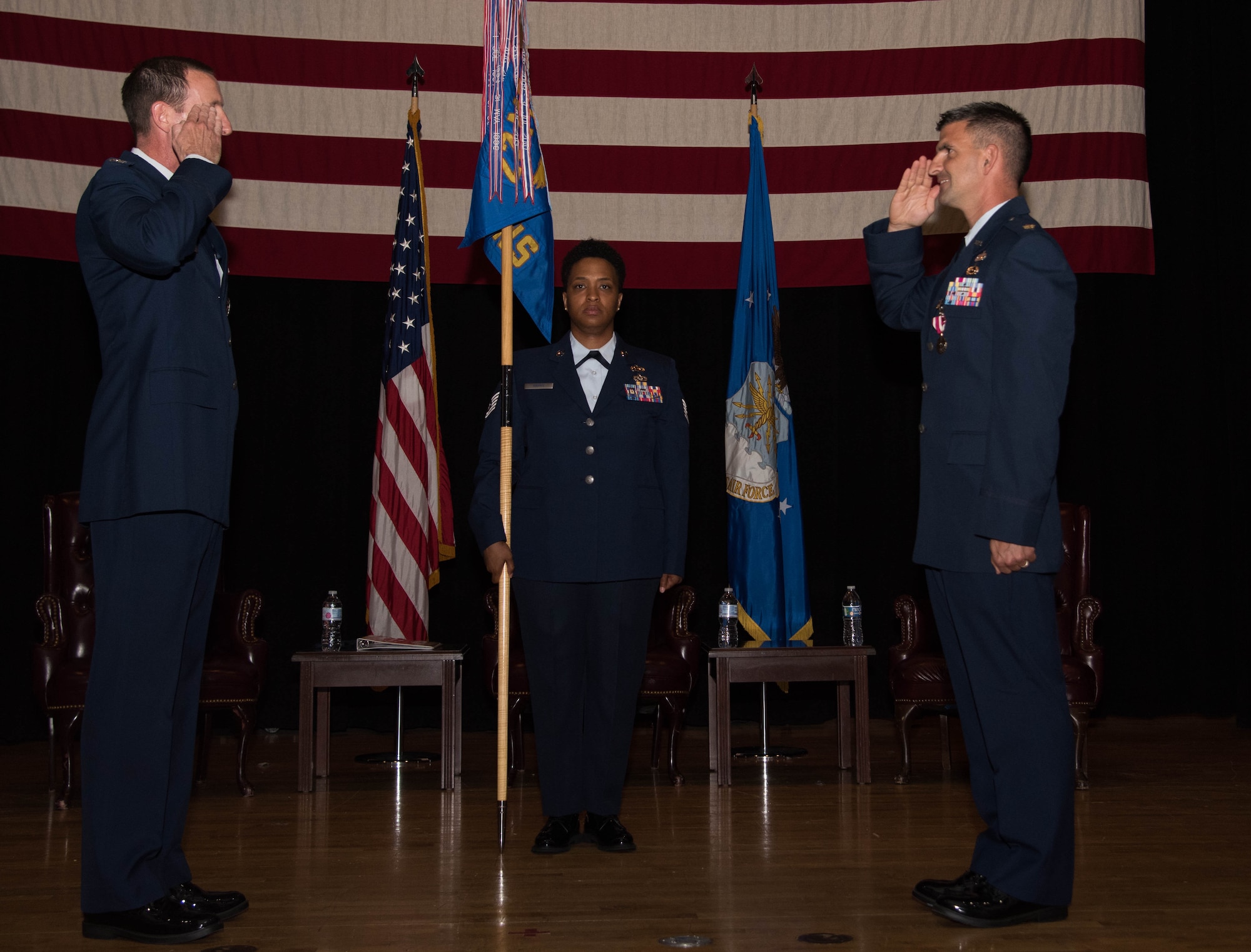 Maj. Michael Mealiff, 22nd Contracting Squadron outgoing commander, right, relinquishes command during a change of command ceremony June 18, 2020, at McConnell Air Force Base, Kansas. Mealiff served as the 22nd CONS commander for two years and will continue to serve at Maxwell Air Force Base, Alabama, where he will attend Air Command and Staff College. (U.S. Air Force photo by Airman 1st Class Marc A. Garcia)