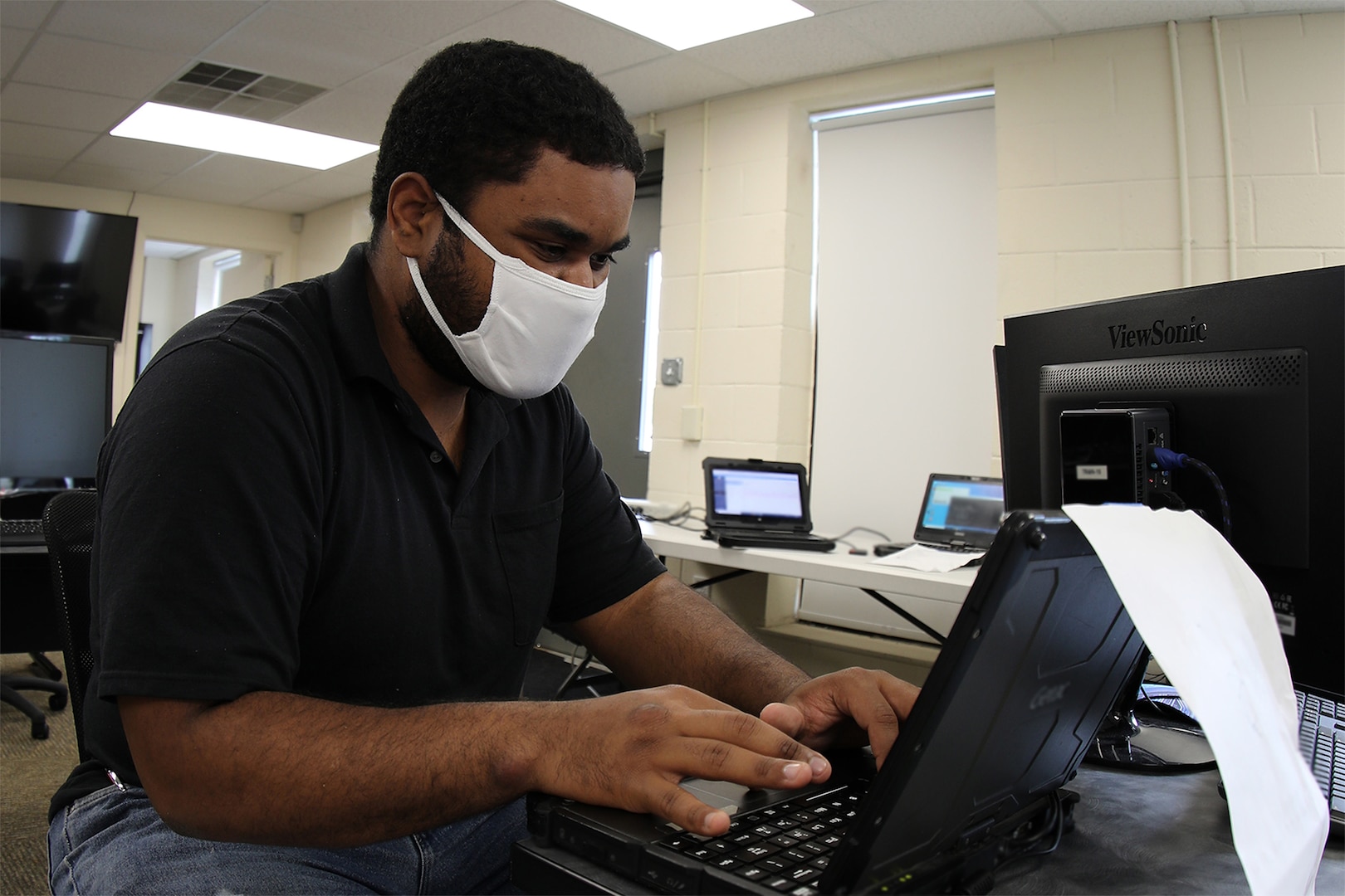 Spc. Carlos Cirano, a security analyst assigned to the North Carolina National Guard Cyber Security Response Force (CSRF), conducts cyber operations at a city of Roxboro facility in Roxboro, North Carolina, June 18, 2020.  The CSRF helped restore city and county computer networks after a cyberattack in late May.