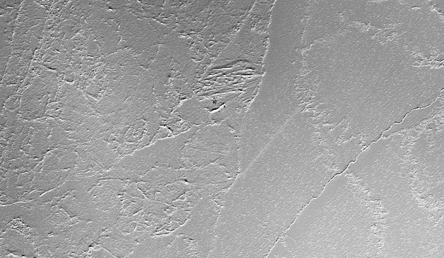 A satellite view of the U.S. Navy ice camp, Camp Seadragon, shows the runway and the surrounding sea ice with its jumbles of piled ridges and flat plates all fused together March 2, 2020. Beneath the ice, the Arctic Ocean is thousands of feet deep.