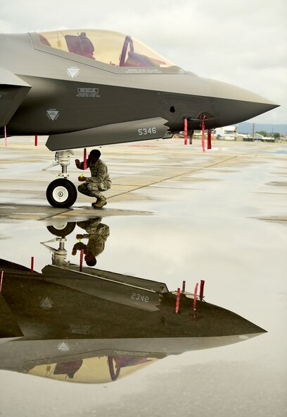 U.S. Air Force Airman 1st Class Scott Nabors, a 356th Aircraft Maintenance Unit F-35A Lightning II crew chief, inspects the aircraft after landing at the Fairbanks International Airport, June 24, 2020.