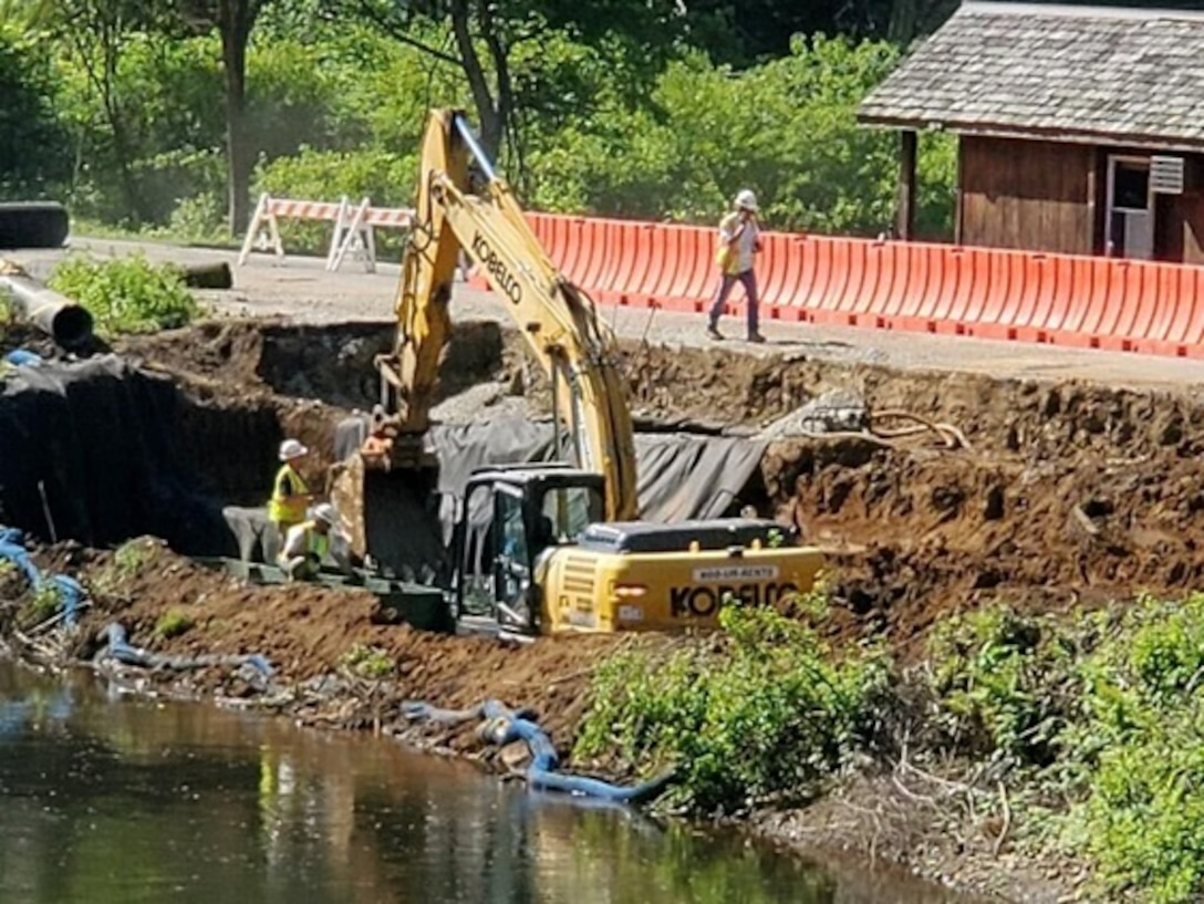Heavy construction machinery continues repairs along the access road to and an embankment of a dam in Tionesta, Pennsylvania June 25, 2020.