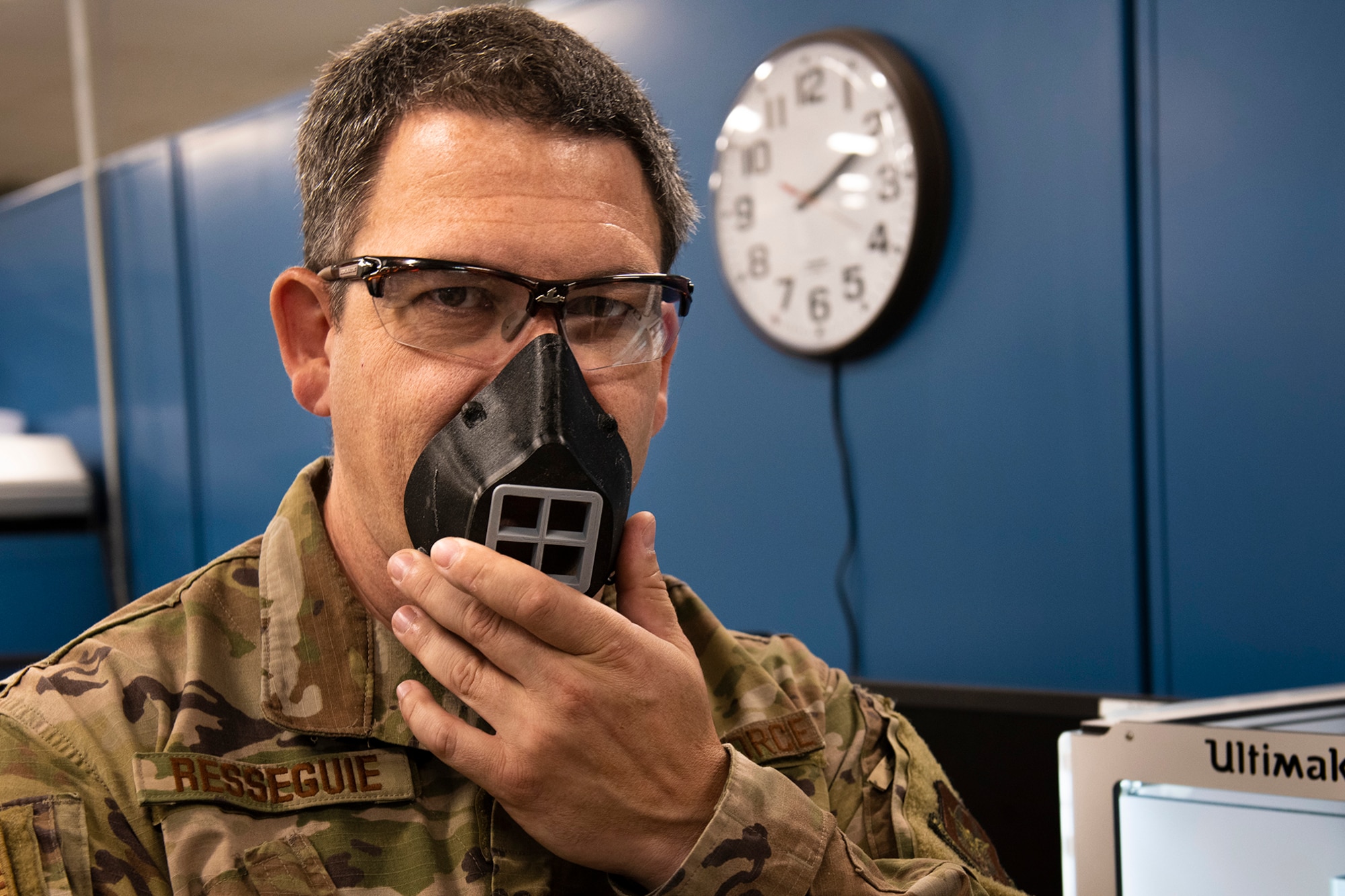 Tech. Sgt. Michael Resseguie, 919th Special Operations Maintenance Squadron metals technology craftsman, dons a 3D-printed face-covering created by the metals technology shop at Duke Field, Florida, June 23, 2020.