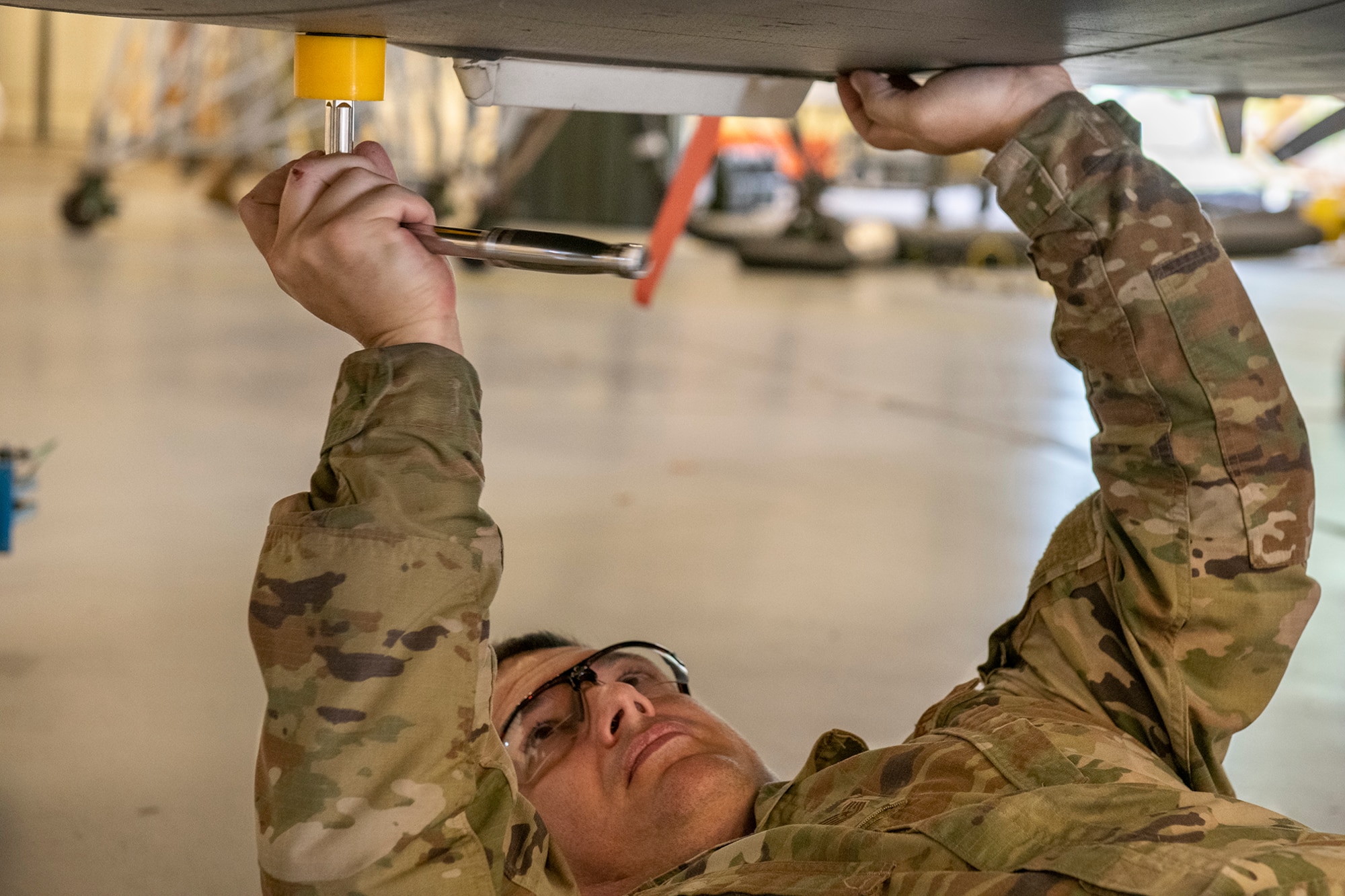 Tech. Sgt. Michael Resseguie, 919th Special Operations Maintenance Squadron metals technology craftsman, uses a custom 3D-printed jackpad plug removal tool, June 23, 2020, at Duke Field, Florida.