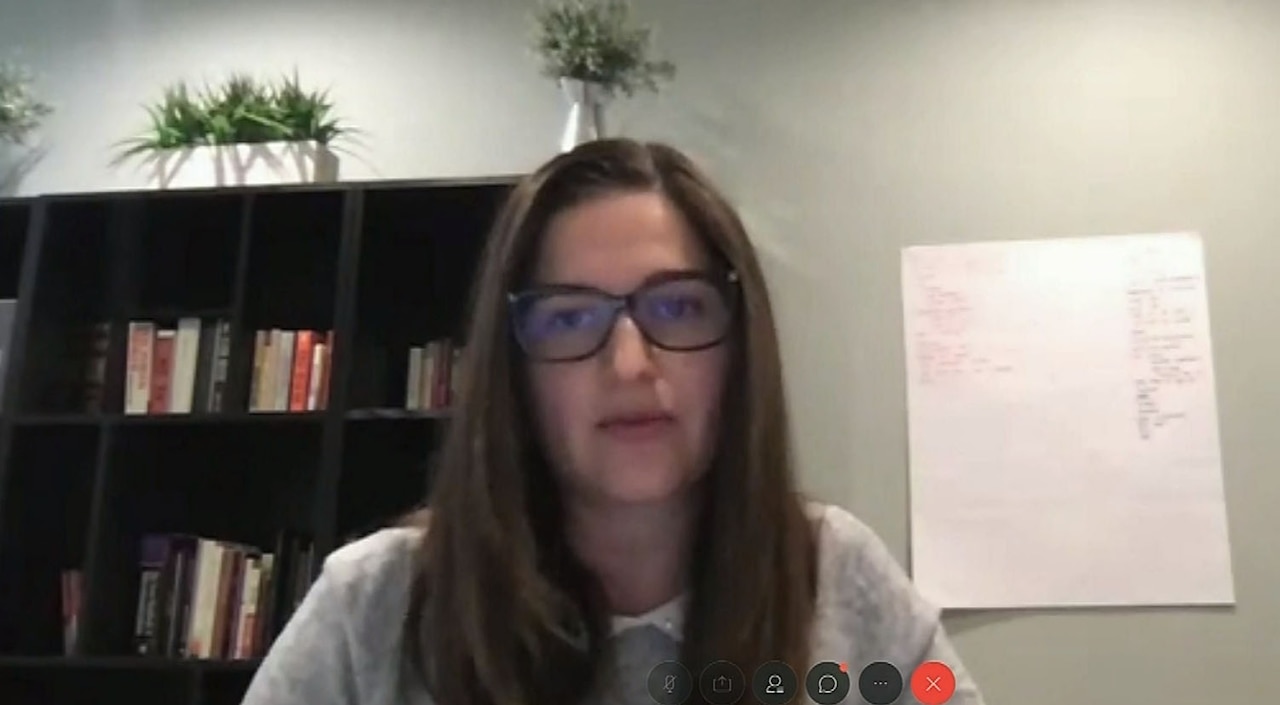 A woman speaks during a video conference.