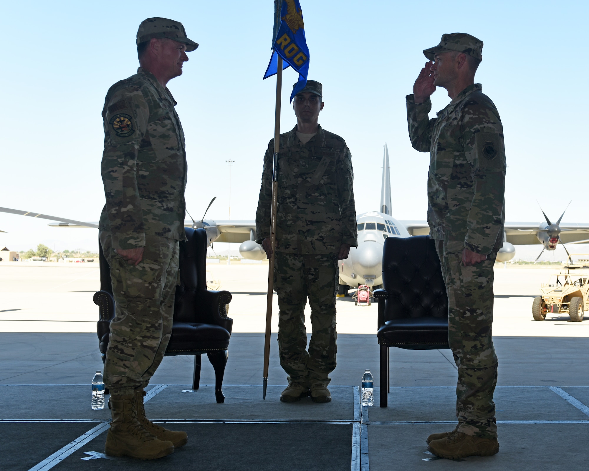 photo of a U.S. Air Force member saluting another during a change of command ceremony