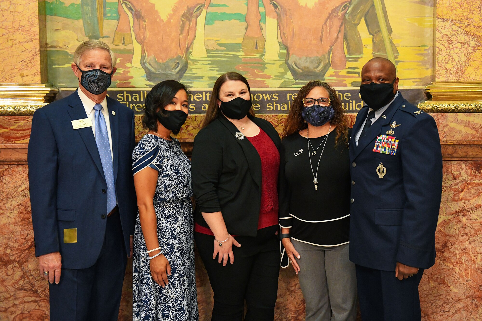 Dave Gruber (left), Aurora city councilmen, and Col. Devin Pepper, 460th Space Wing commander,poses with prominent Buckley Air Force Base spouses for a group photo at the Colorado State Capitol Building in Denver, June 25, 2020.