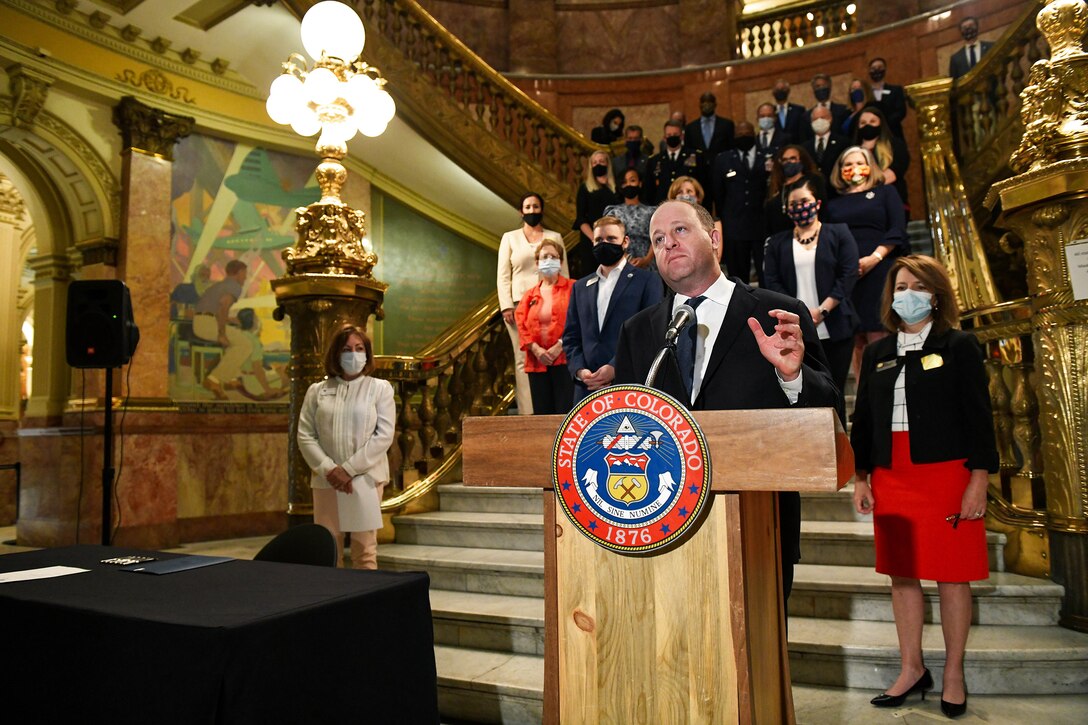 Colorado Gov. Jared Polis gives a speech during the signing of Colorado House Bill 20-1326 at the Colorado State Capitol Building in Denver, June 25, 2020.