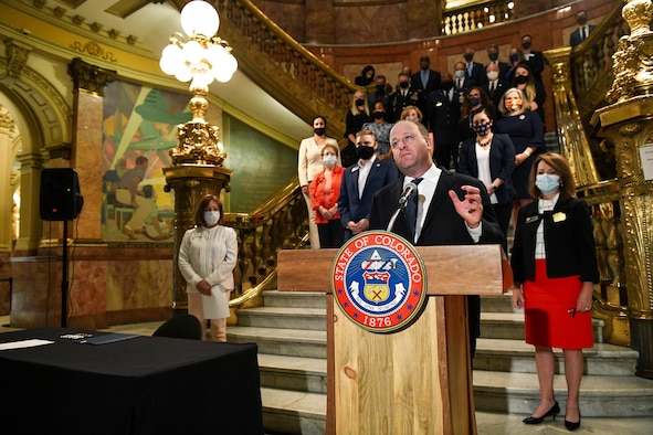 Colorado Gov. Jared Polis gives a speech during the signing of Colorado House Bill 20-1326 at the Colorado State Capitol Building in Denver, June 25, 2020.