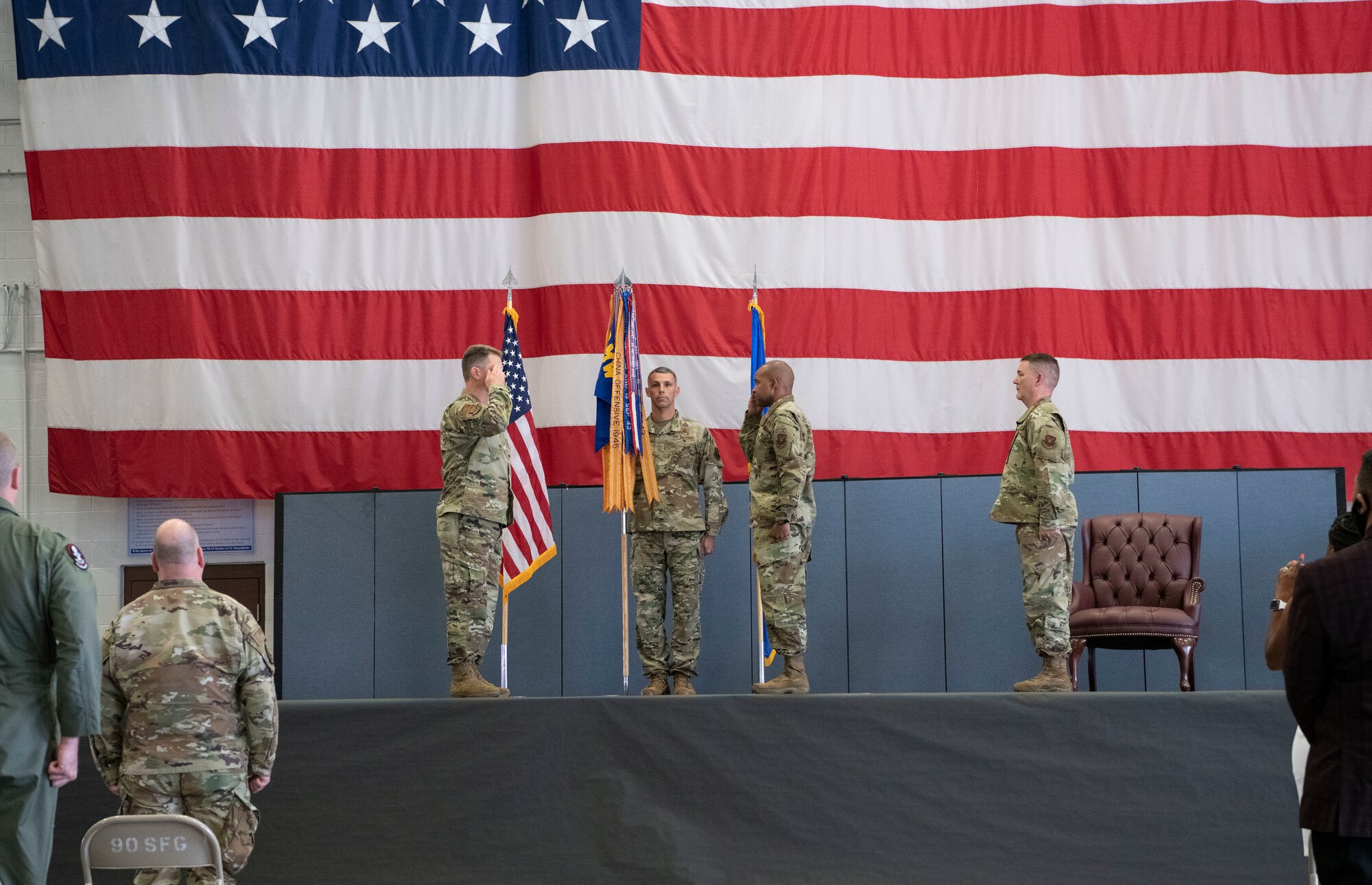 Colonel Peter Bonetti, 90th Missile Wing commander, salutes, Colonel Tytonia Moore, 90th Operations Group incoming commander, as he assumes command of the 90th OG during a change of command ceremony June, 26, 2020, on F.E. Warren Air Force Base, Wyo. A change of command ceremony is a tradition that represents a formal transfer of authority and responsibility from the outgoing commander to the incoming commander. (U.S. Air Force photo by Senior Airman Braydon Williams)