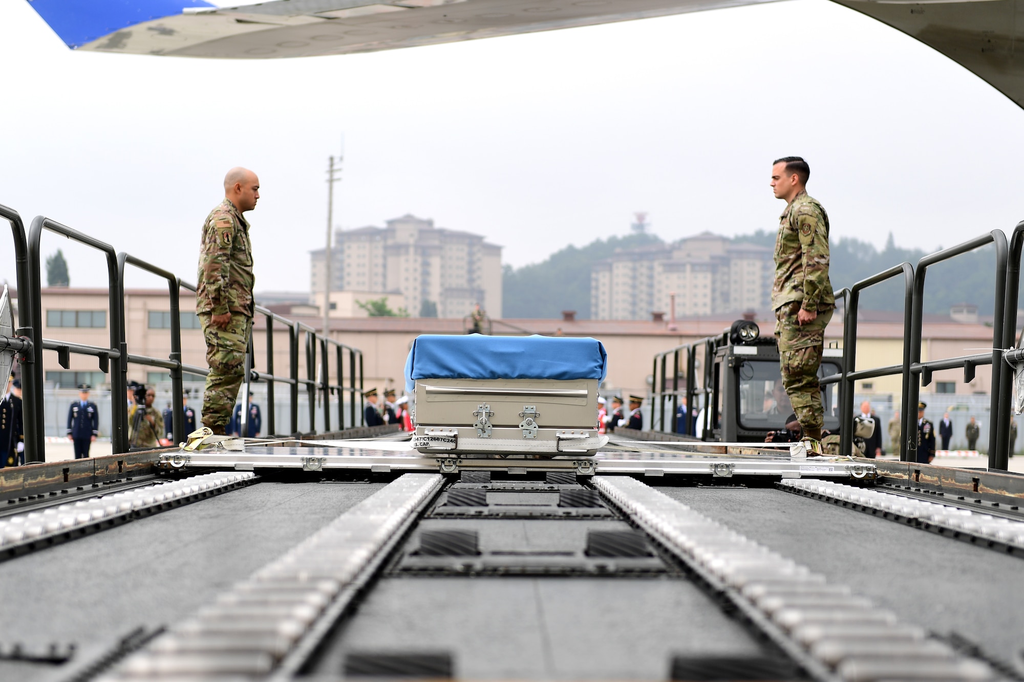 A casket sits on a loader