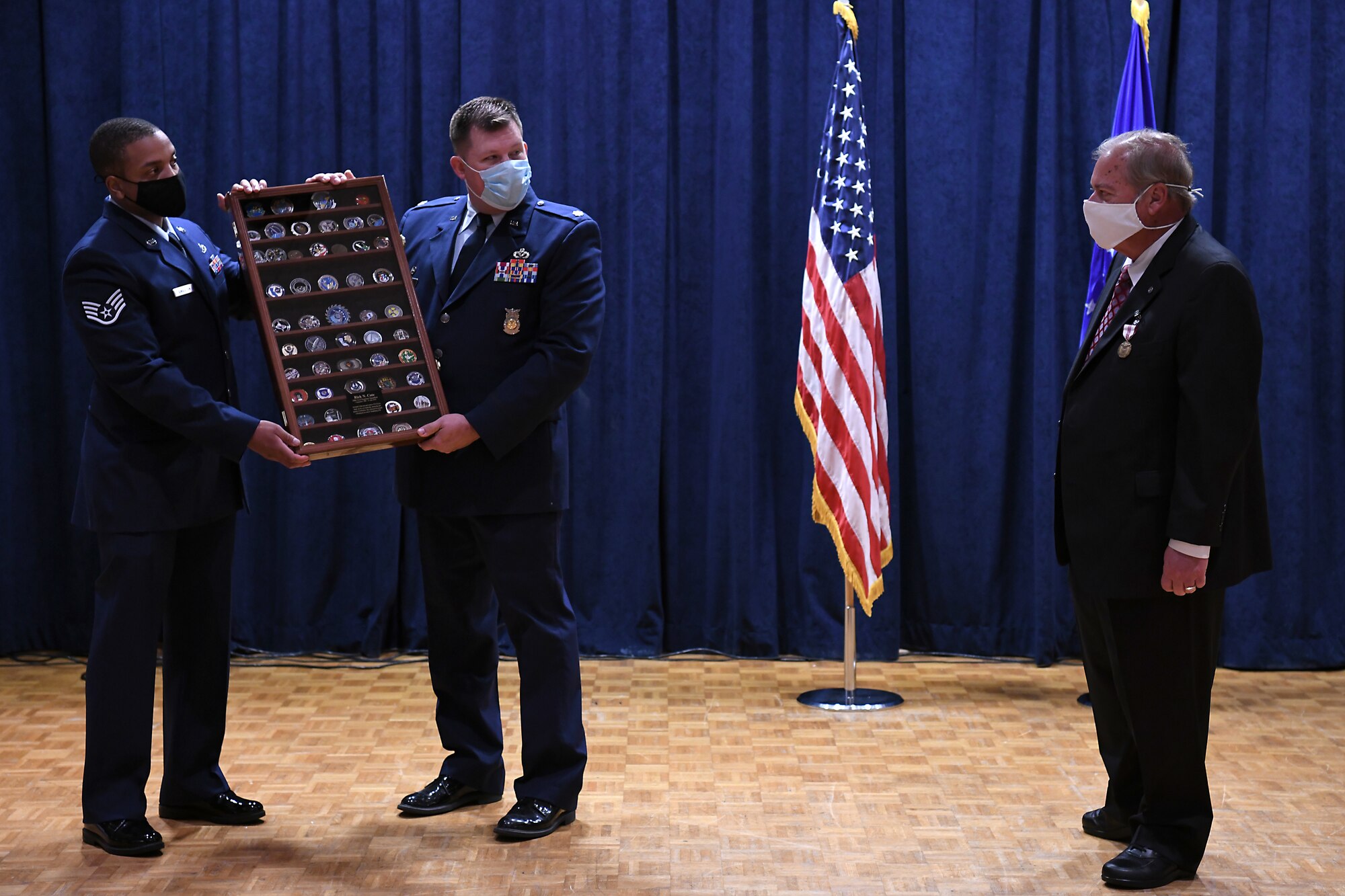 Richard Cote, 30th Civil Engineer Squadron deputy commander, is presented with a gift during his retirement ceremony June 25, 2020, at Vandenberg Air Force Base, Calif.
