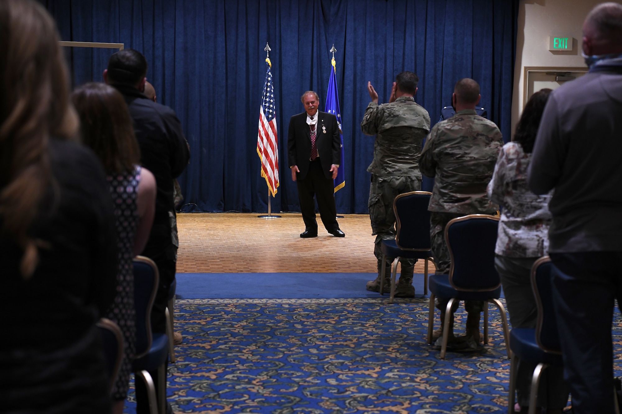 The crowd stands and applauds as Richard Cote, 30th Civil Engineer Squadron deputy commander, retires after nearly 40 years of service in the 30th CES June 25, 2020, at Vandenberg Air Force Base, Calif.