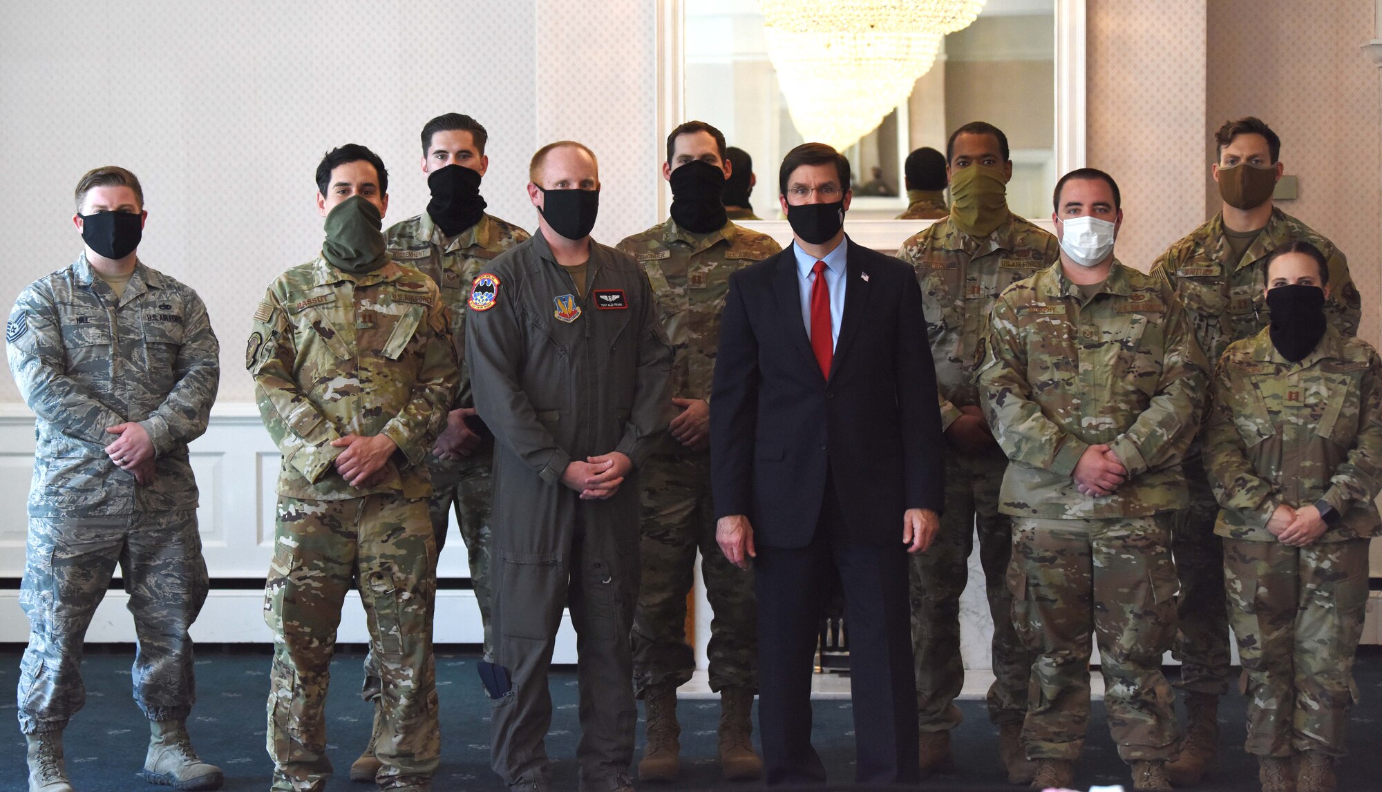 U.S. Secretary of Defense Dr. Mark T. Esper poses for a photo with Airmen during a visit at RAF Mildenhall, England, June 25, 2020. Esper met with 100th ARW, 352nd Special Operations Wing, Royal Air Force and tenant unit leadership to learn of the various mission sets and discuss the base’s role in operations in both the European and African theaters. (U.S. Air Force photo by Senior Airman Brandon Esau)