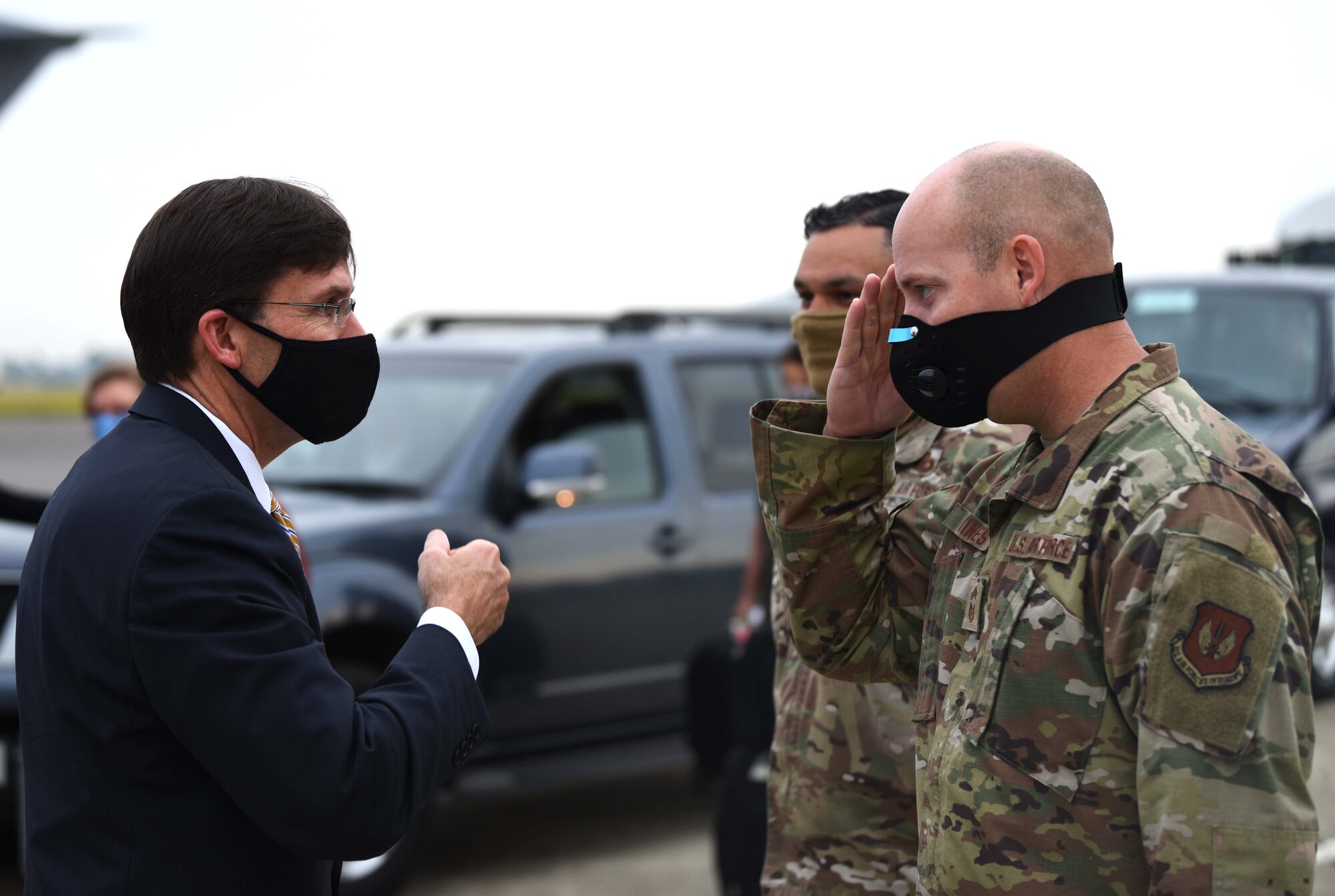 Chief Master Sgt. Douglas Vines, 100th Civil Engineer Squadron career enlisted manager, salutes U.S. Secretary of Defense Dr. Mark T. Esper before his departure from RAF Mildenhall, England, June 26, 2020. Esper met with 100th ARW, 352nd Special Operations Wing, Royal Air Force and tenant unit leadership to learn of the various mission sets and discuss the base’s role in operations in both the European and African theaters. (U.S. Air Force photo by Brandon Esau)