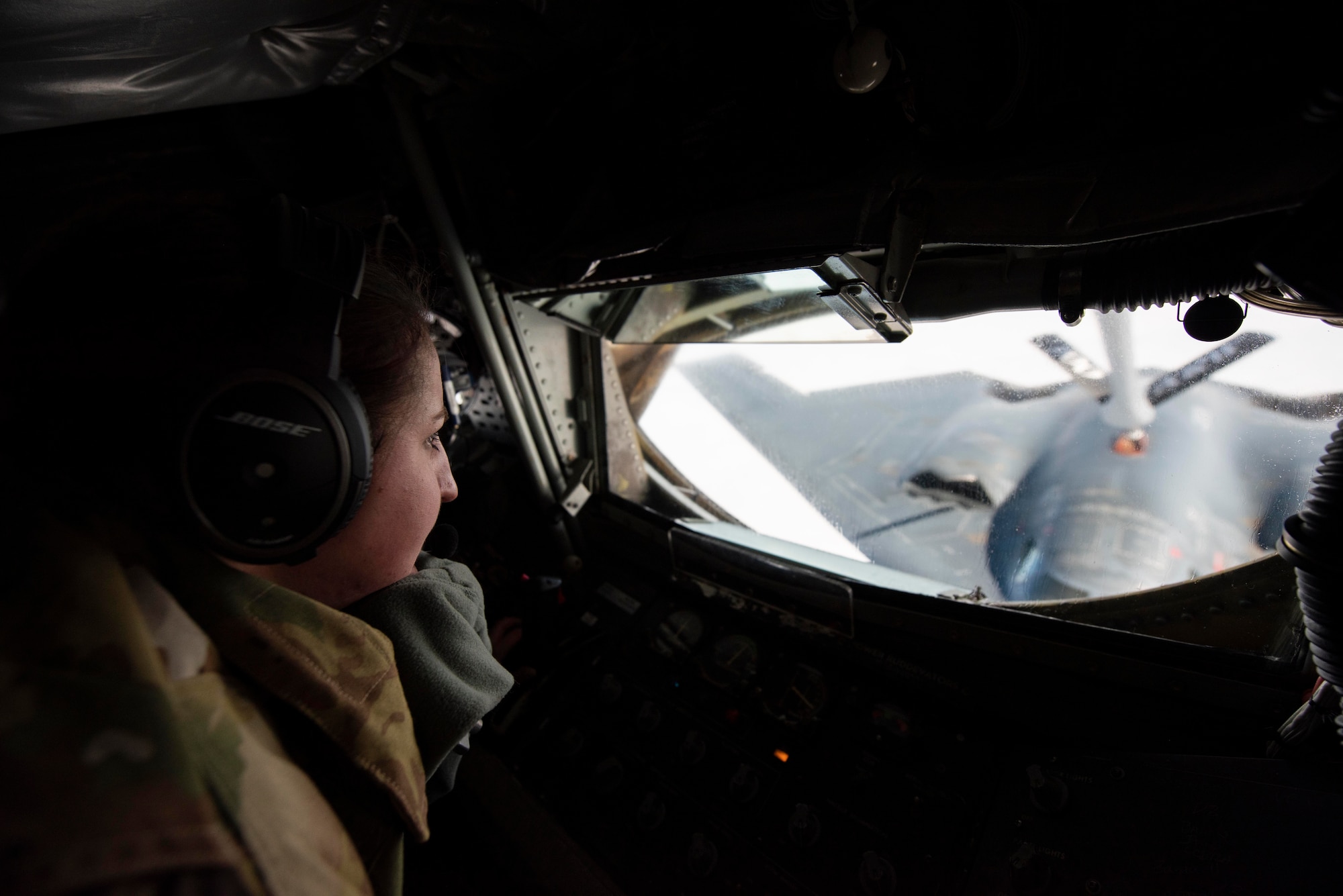 Staff Sgt. Kaylene LaRose, 351st Air Refueling Squadron boom operator, refuels a B-2 Spirit assigned to the 509th Bomb Wing at Whiteman Air Force Base, Missouri, over the North Sea June 18, 2020.  Two female aircrews in a four-ship formation refueled B-2 Spirits conducting a strategic bomber mission north of the Arctic Circle. (U.S. Air Force photo by Airman 1st Class Joseph Barron)