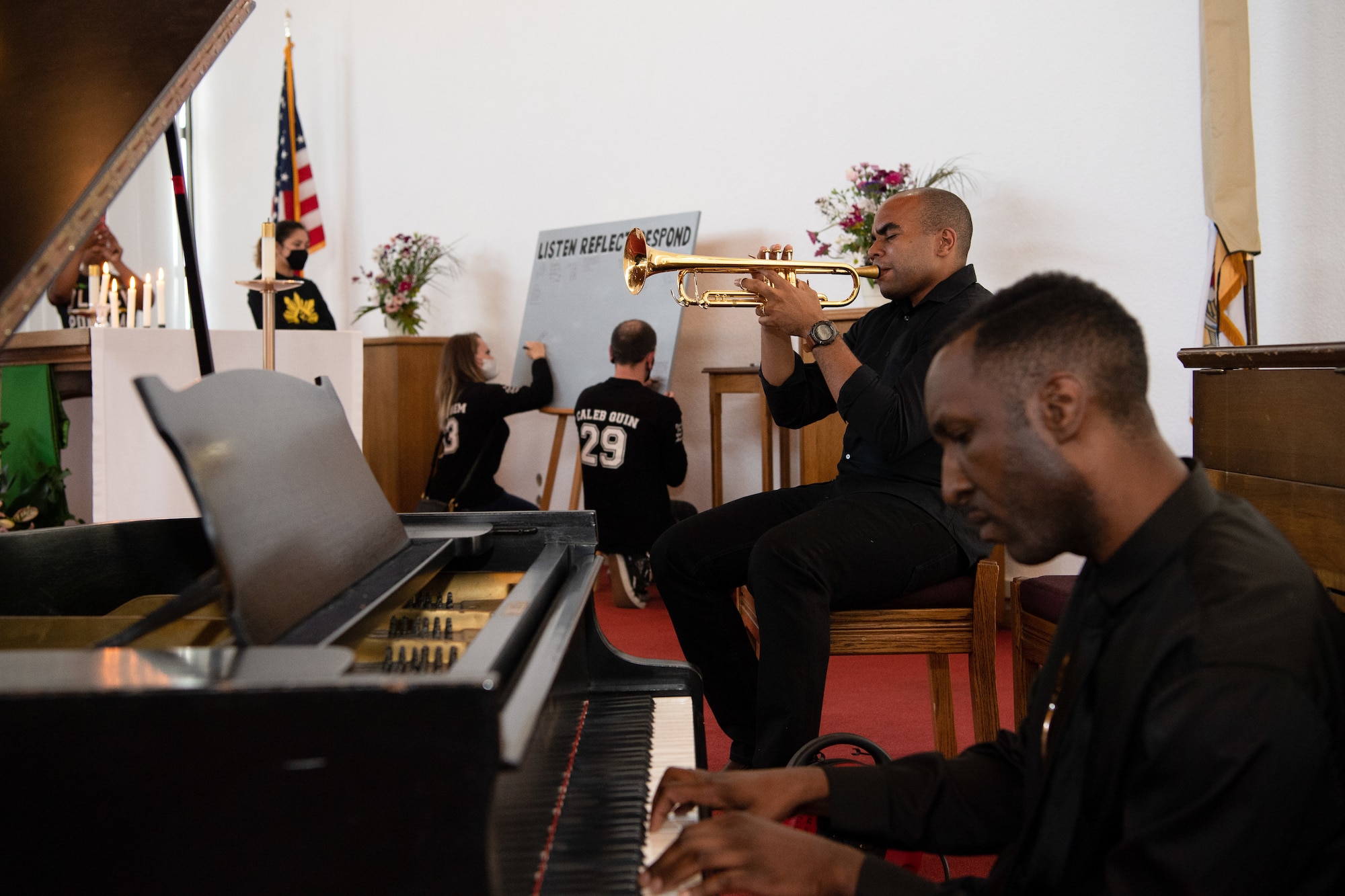 U.S. Army Sgt. 1st Class Christian William, U.S. Army Europe Band and Chorus platoon sergeant, and Spc. Willie Reed, USAREUR Band and Chorus pianist, play music during the Juneteenth: Vigil for Healing event at Ramstein Air Base, Germany, June 19, 2020.