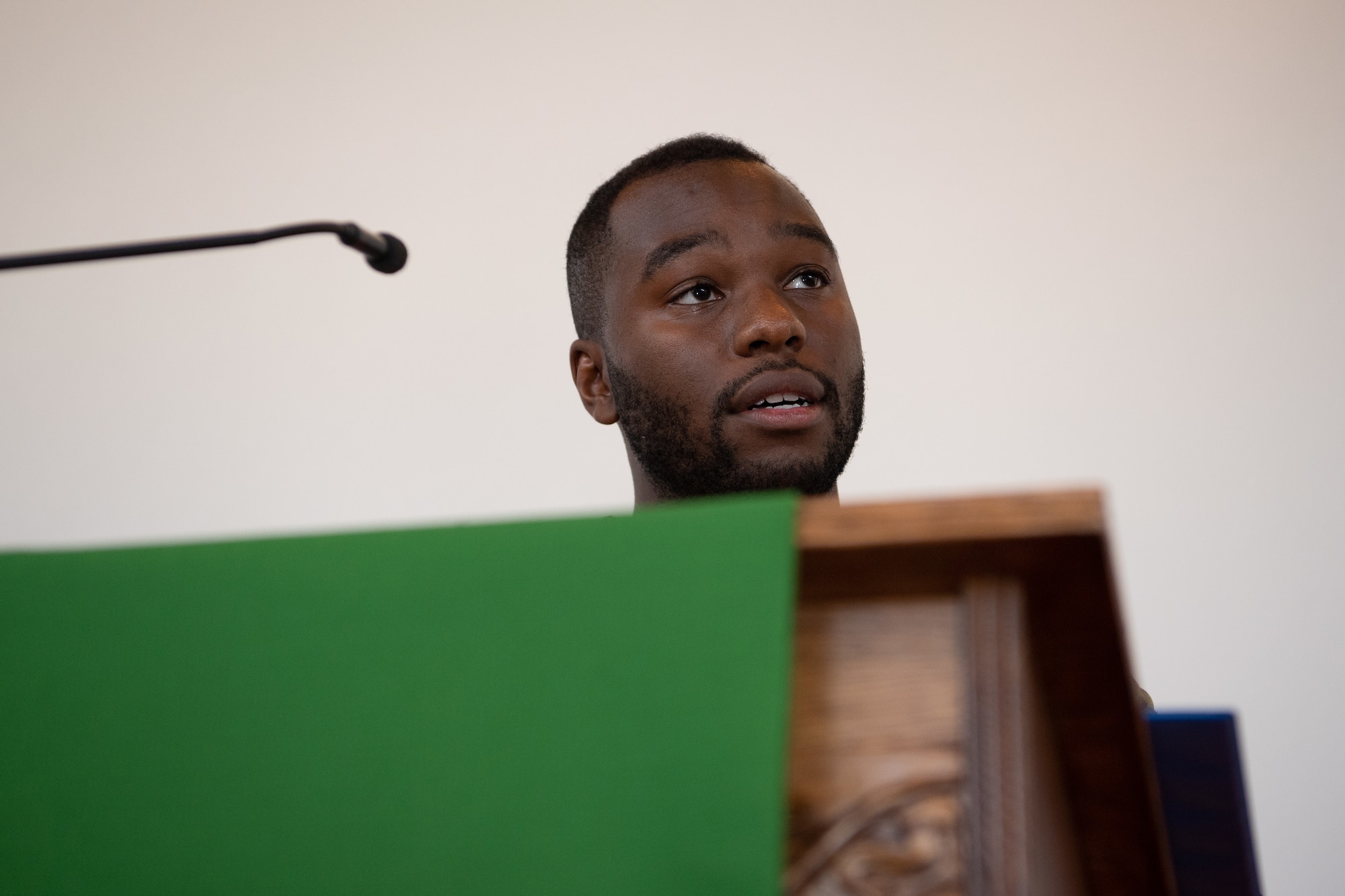 U.S. Air Force Staff Sgt. George Linen, 86th Force Support Squadron Airman Leadership School instructor, recites a poem during the Juneteenth: Vigil for Healing event at Ramstein Air Base, Germany, June 19, 2020.