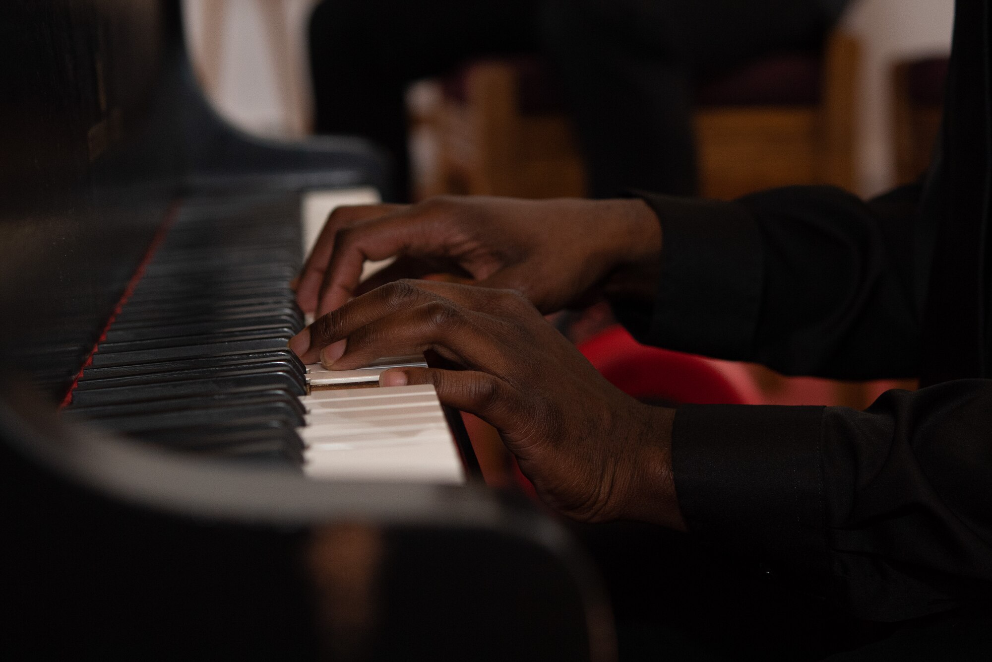 Close up of U.S. Army Spc. Willie Reed, U.S. Army Europe Band and Chorus hands playing the piano during the Juneteenth: Vigil for Healing event at Ramstein Air Base, Germany, June 19, 2020.