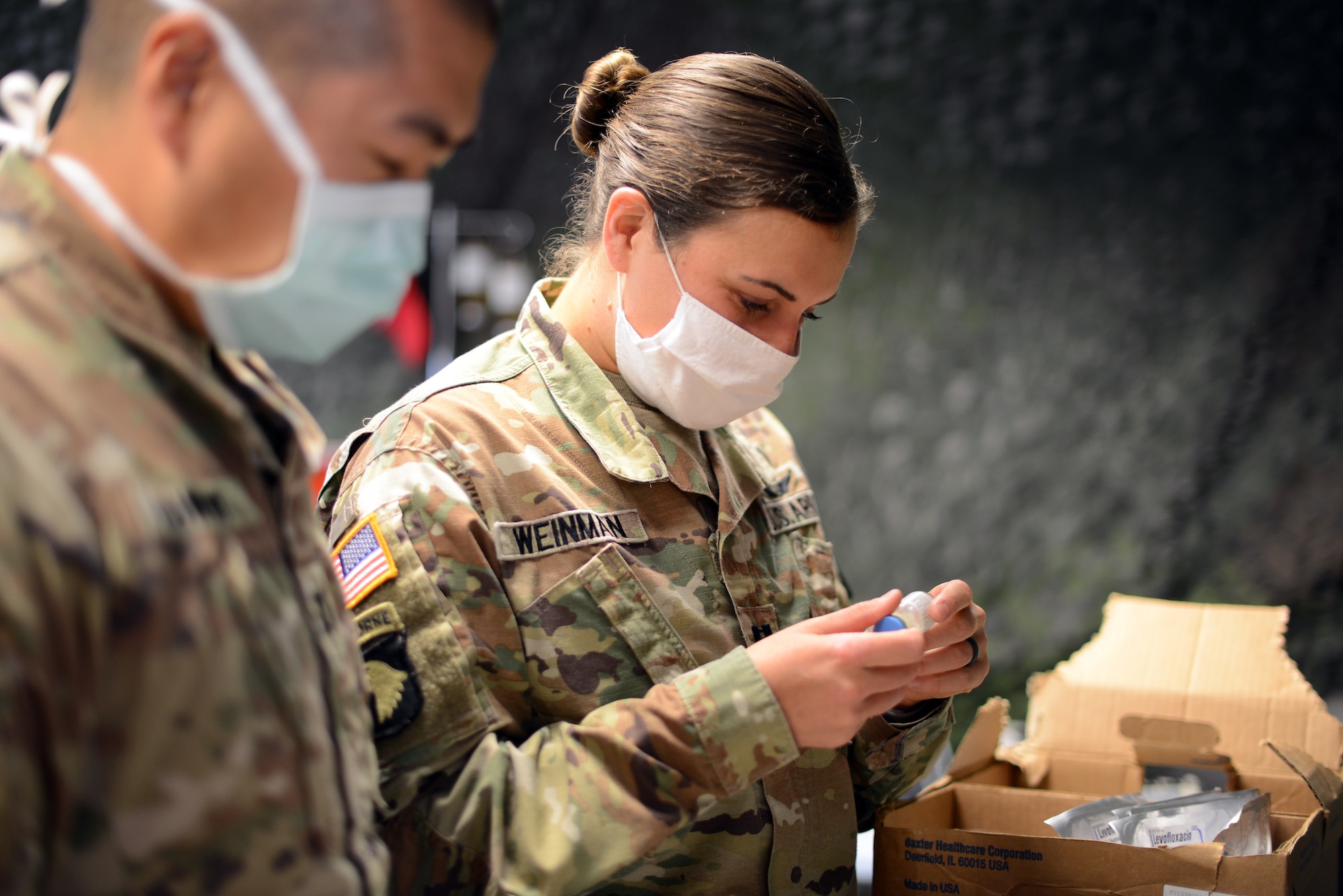 U.S. Army Capt. Jessica Weinman, 67th Forward Resuscitative Surgical Team Emergency Nurse, reviews the medication stock and prepares commonly used medications for an inbound patient prior to a training scenario at the Medical Simulation Training Center, Ramstein Air Base, June 19, 2020.