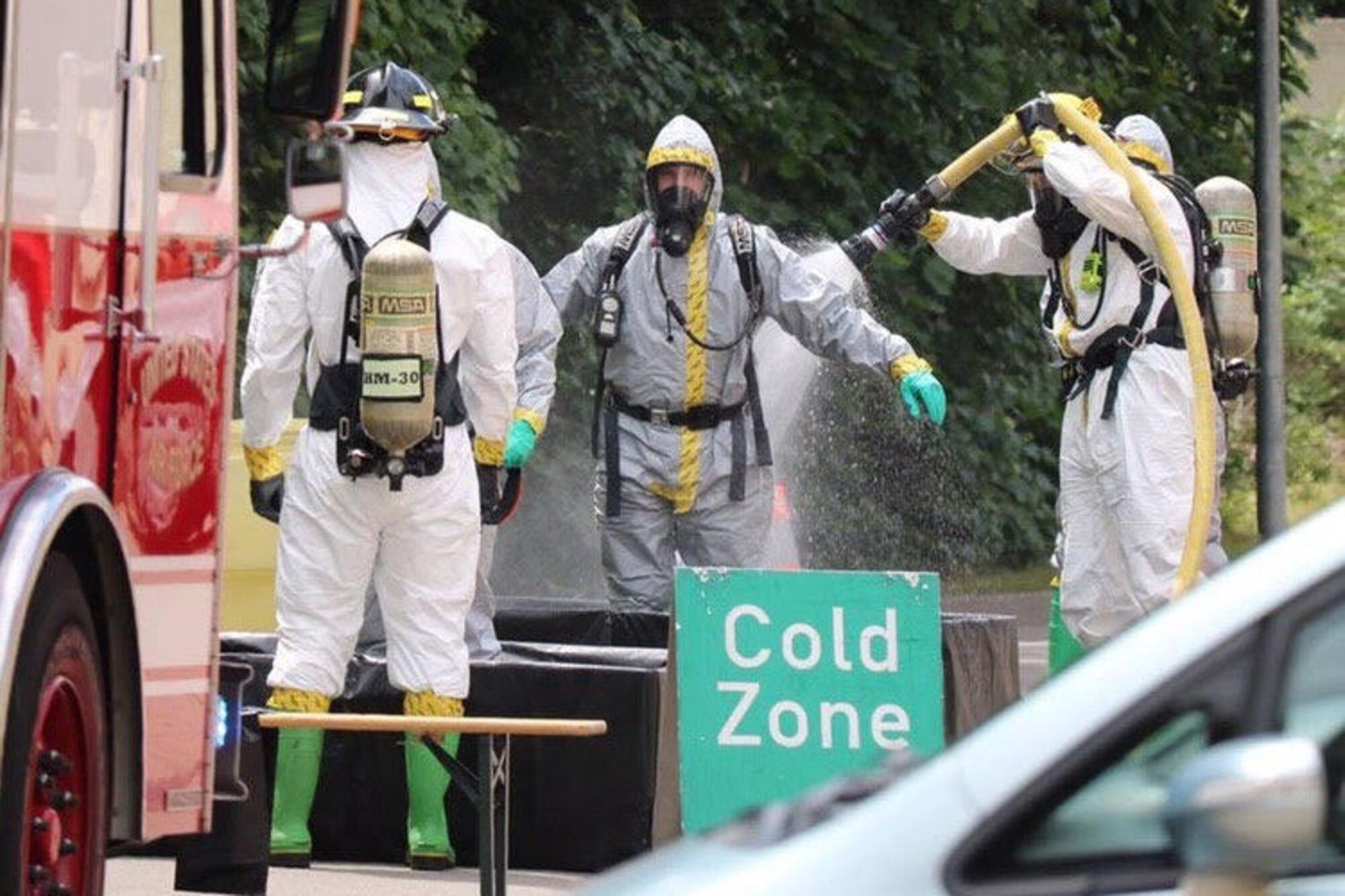 U.S. Air Force Staff Sgt. Erickson Zinger, 786th Civil Engineer Squadron Emergency Management Logistics noncommissioned officer in charge, goes through technical decontamination, provided by the 86th CES Fire Department, as he returns from the incident area to a clean zone.