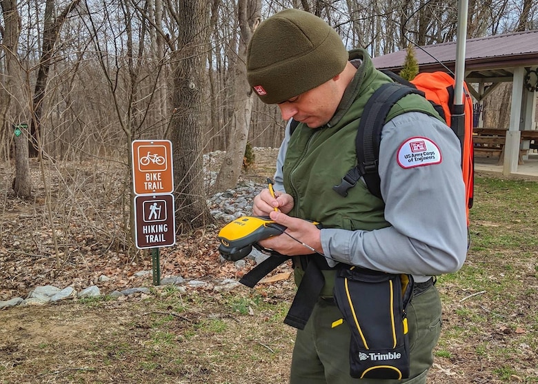 Shane Brady uses a Trimble Geographic Information System (GIS) 150 device to collect spatial and geographic data on public trails for the U.S. Army Corps of Engineers, Nashville District.