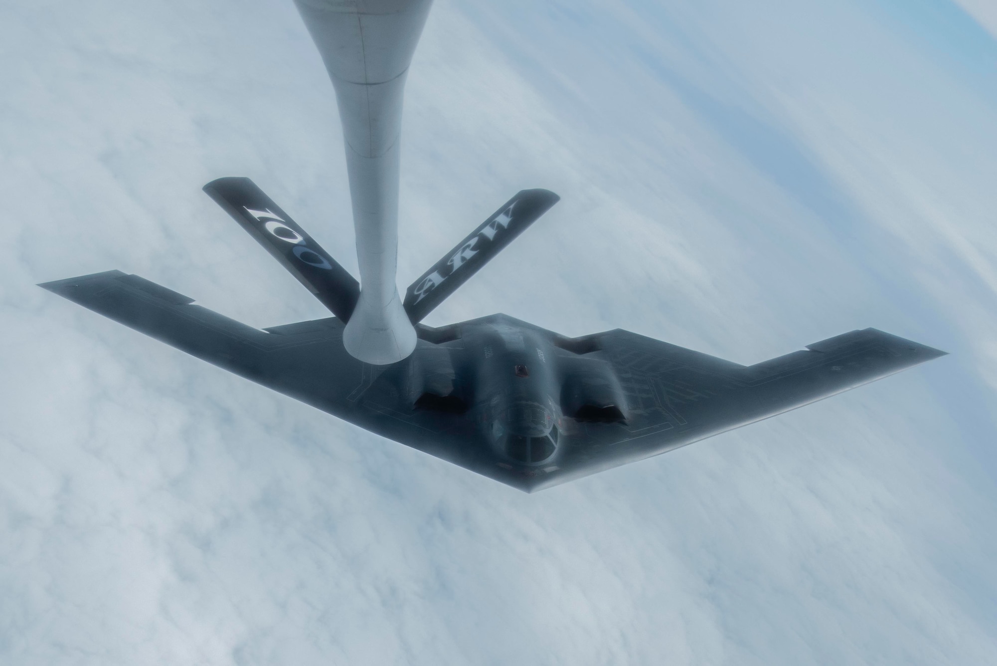 A B-2 Spirit assigned to the 509th Bomb Wing at Whiteman Air Force Base, Missouri, departs after refueling with a KC-135 Stratotanker assigned to the 100th Air Refueling Wing, RAF Mildenhall, England, June 18, 2020. The aerial refueling was conducted in support of a strategic bomber mission north of the Arctic Circle.  (U.S. Air Force photo by Airman 1st Class Joseph Barron)